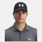 Man wearing a black Under Armour cap and gray polo shirt on a white background